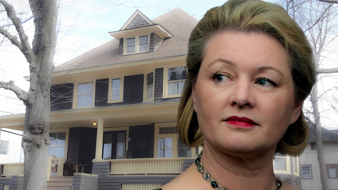 Imposed in front of an historic, two story weatherboard house, is the image of a blond woman gazing to her right in reminiscing. Her expression is mixed and hard to read. She appears calm and disturbed at the same time.